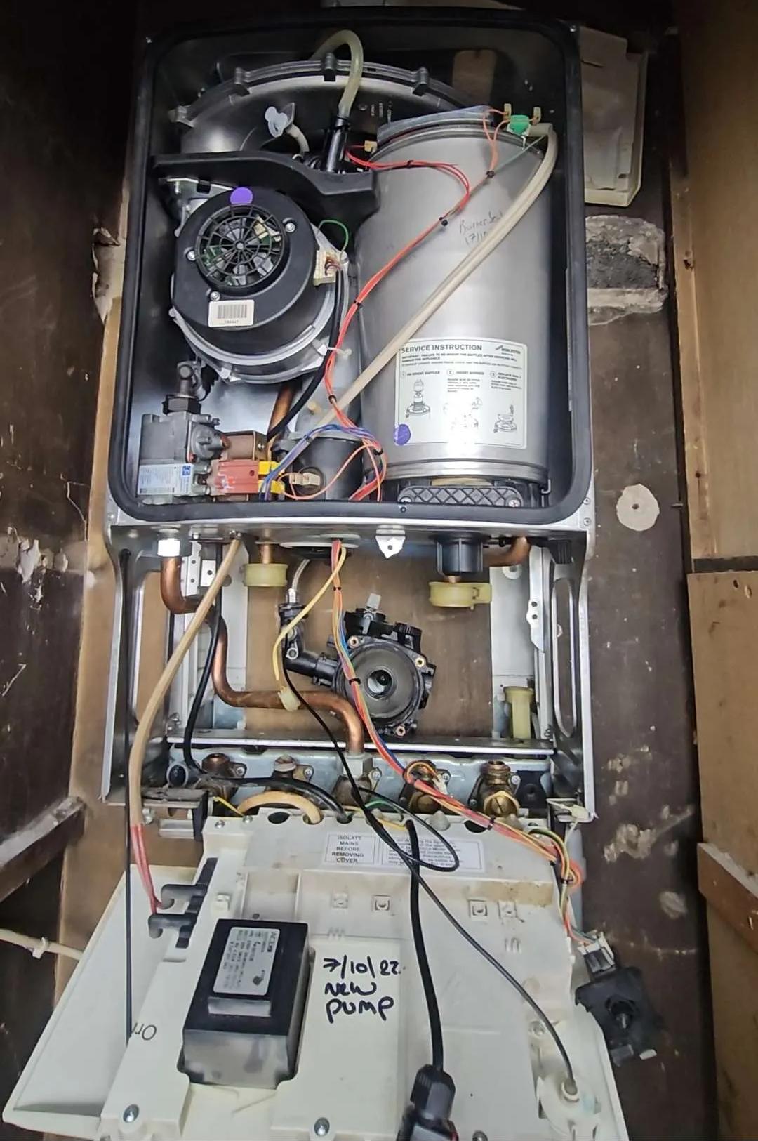 Worcester combi boiler opened up for a pump replacement by JJK Gas Services in Wigan